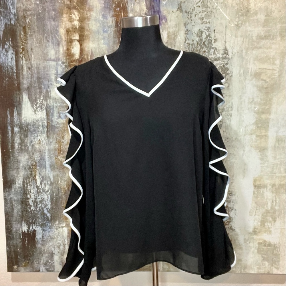 V-neck black tunic with white ruffle trim sleeve